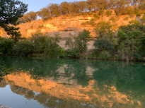 Sunset Reflecting Off Bluff and Water 
