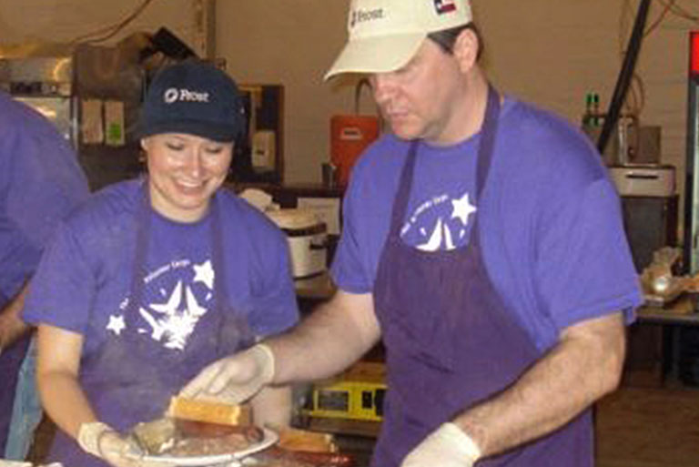 Photo of Frost employees serving food