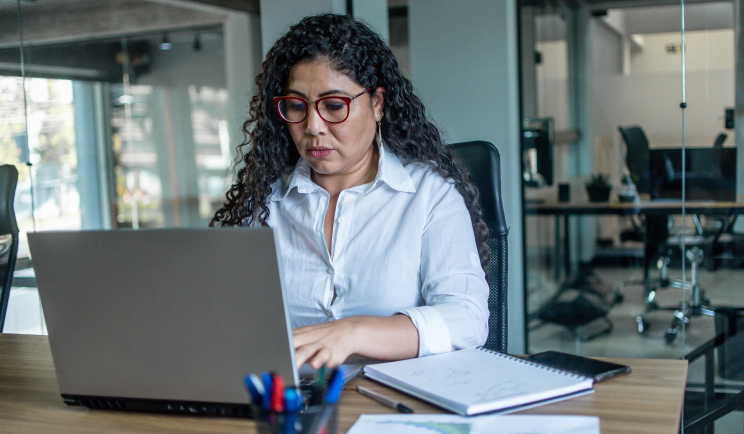 Woman typing on laptop