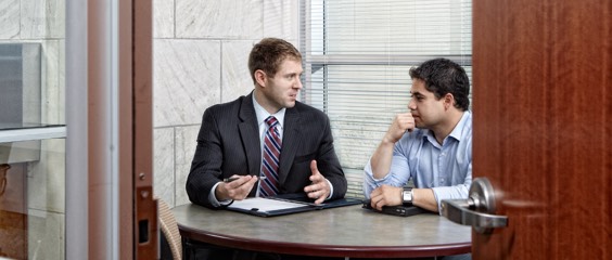 Image of two people meeting