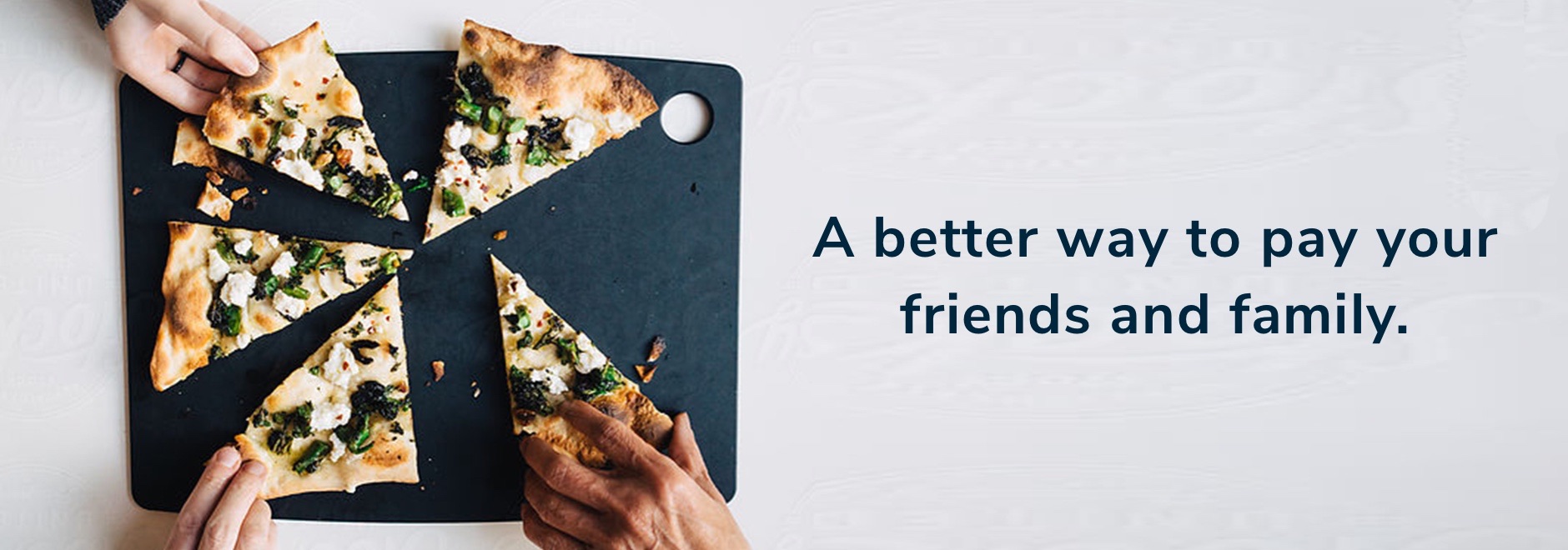 An image of hands grabbing pizza slices off a tray.