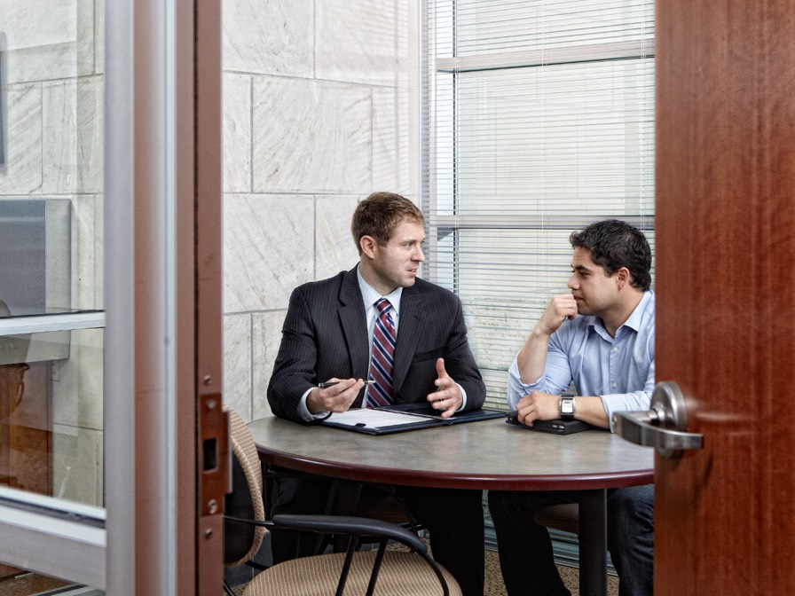 Image of two people meeting