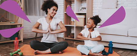 Mom and daughter on yoga mat