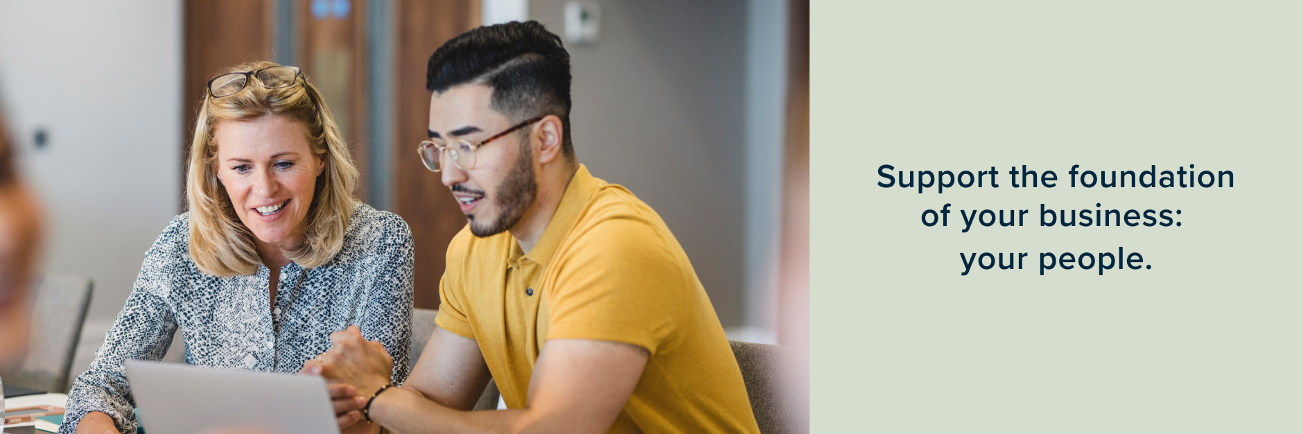 Image of two people at desk