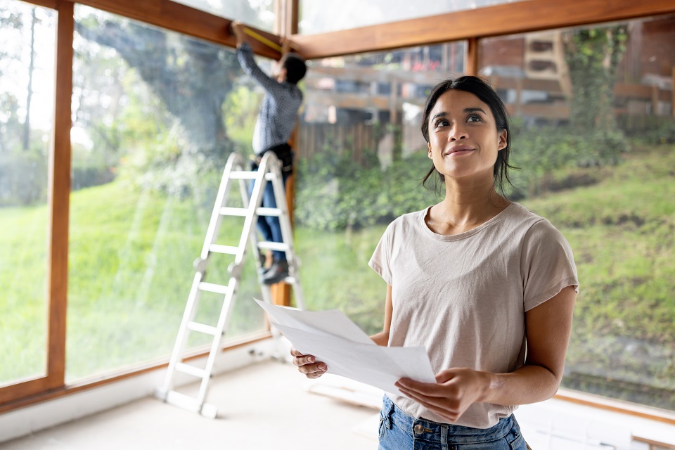 Image of woman looking at house plans
