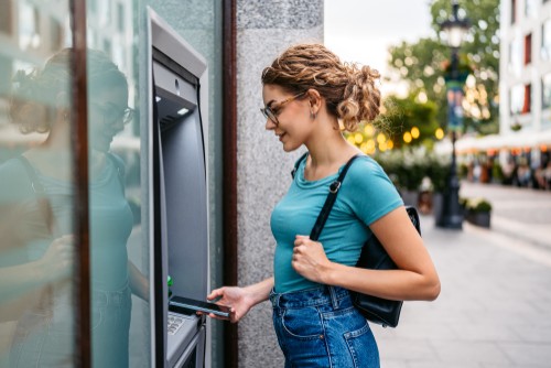 Image of a woman at an ATM