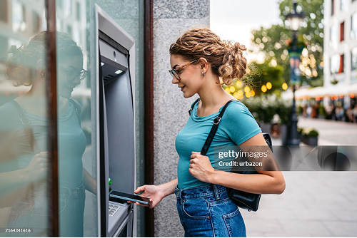 Image of a woman at an ATM