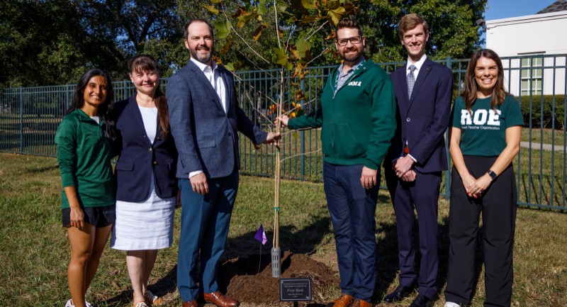 Image of people with planted tree