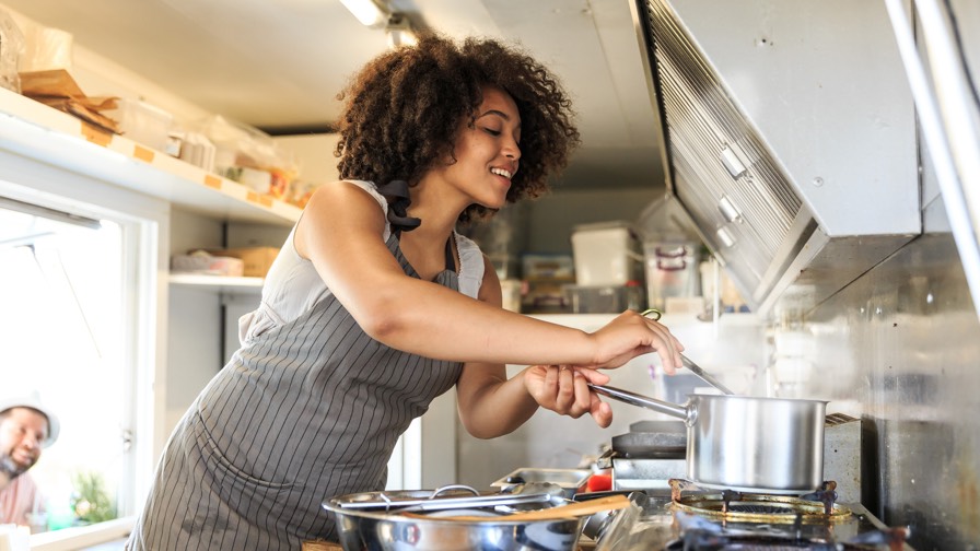 Image of woman cooking in a food truck