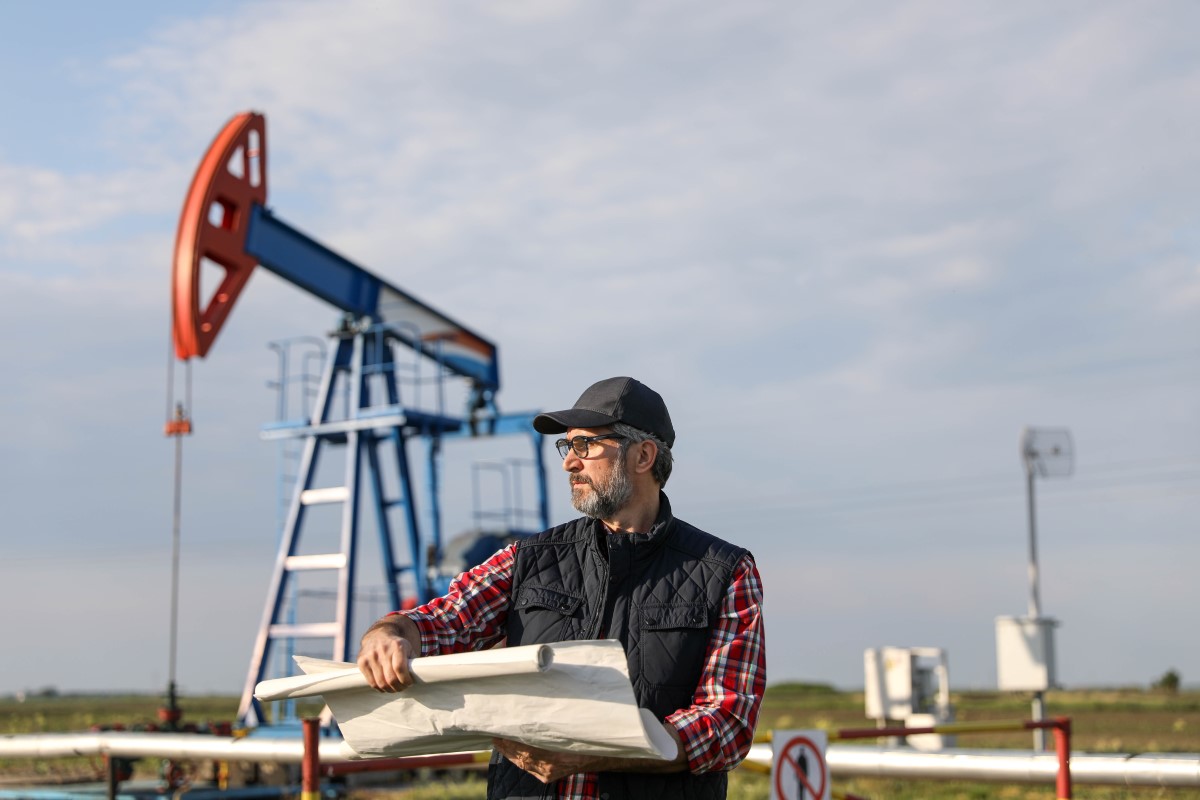 Image of man and oil pump