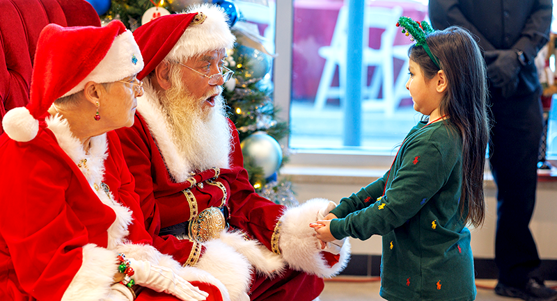 Image of child with Santa