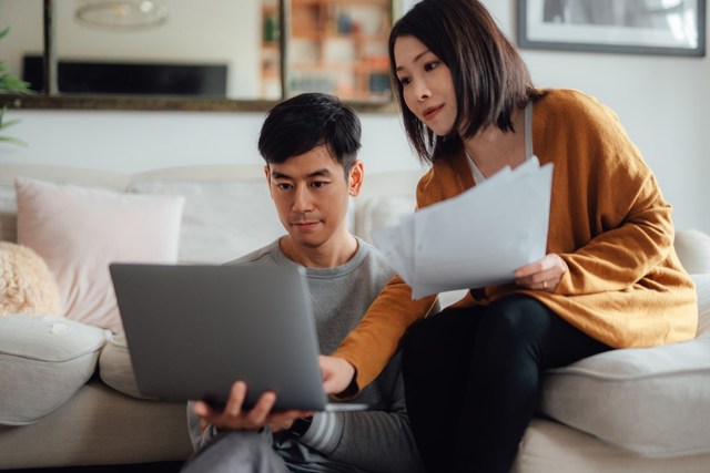 Image of couple with a laptop