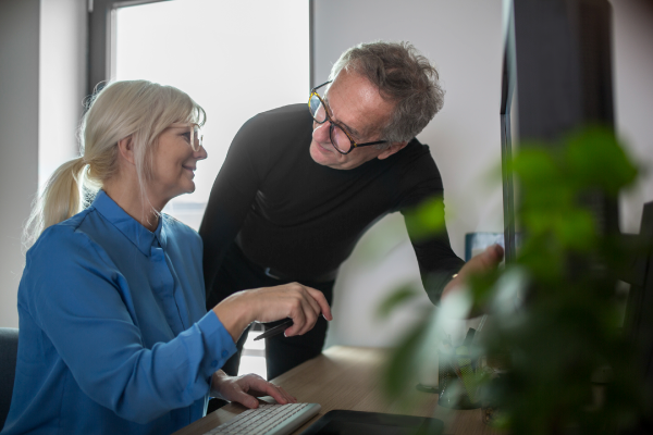 Photo of two people working