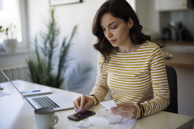 Image of woman with laptop and smart phone