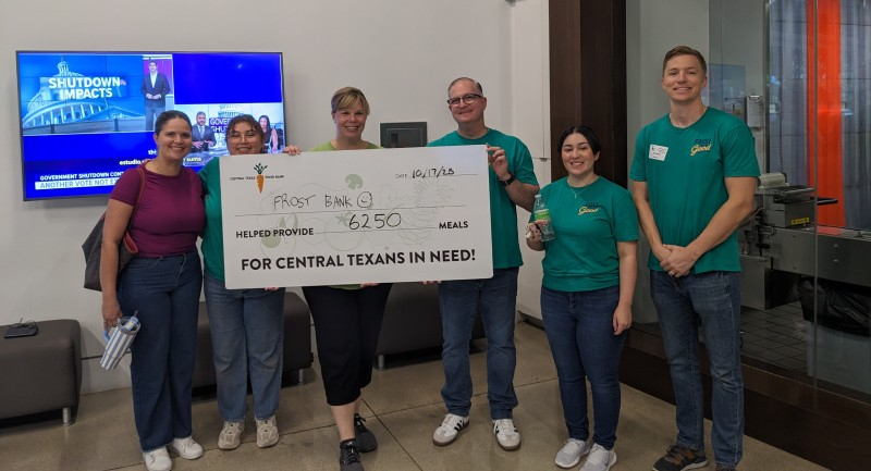 Image of group holding check 